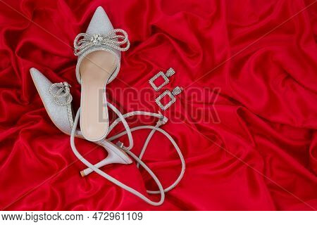 High Heel Shoes  On A Red Background