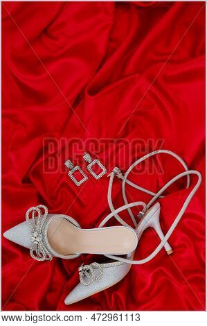 High Heel Shoes  On A Red Background