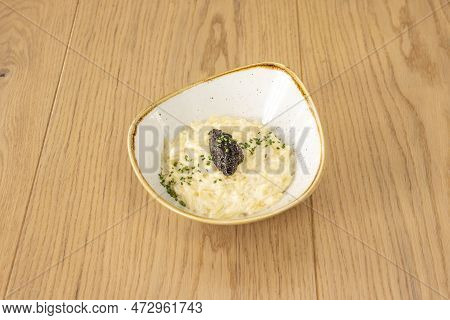 An Exquisite Seasonal Tartufo And Funghi Risotto That Includes Mushrooms, The Star Food Of These Mon