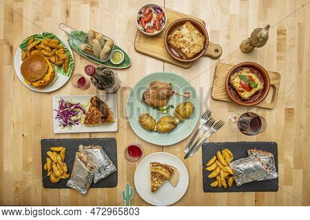 Set Of Delicious Appetizer Dishes, Tapas, Duck Confit, Lasagna, Tarts, Burritos In Foil And Teques W