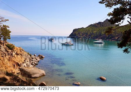 Picturesque Summer Landscape. Yachts In A Bay With Turquoise Water Color. Coniferous Forest. Holiday