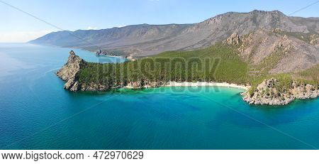Panorama Of The Bay With A Sandy Beach And Turquoise Water Color. Picturesque Summer Landscape. Moun