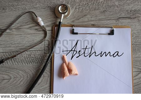 Stethoscope, Human Lung Model And Paper Clipboard With Text Asthma. Medical And Healthcare Concept