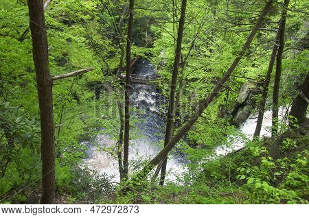 A Large Waterfaill Within Bushkill Falls In Lehman Township Pennsylvania On An Overcast Summer Day.