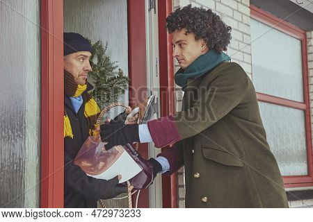 Skive, Denmark, December 2022: Delivery Workers Pretend To Be Robbers