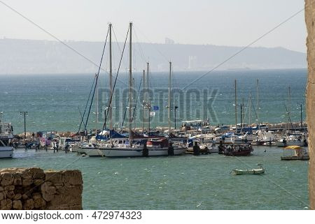 Large And Small Boats Stand On The Berth Await Strong Heat And Dust That Hamsin