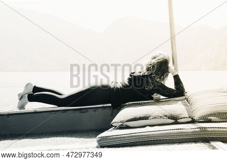 Caucasian Woman Tourist Relax Lay On Vacation On Cruise Ship Deck Enjoy Sunny Persian Gulf Panorama 