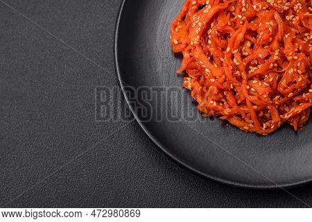 Dried Squid Chopped Into Slices And Seasoned With Sesame Seeds And Spices