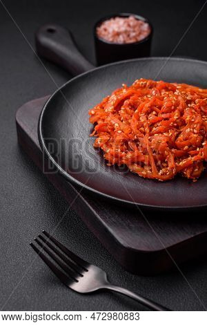 Dried Squid Chopped Into Slices And Seasoned With Sesame Seeds And Spices