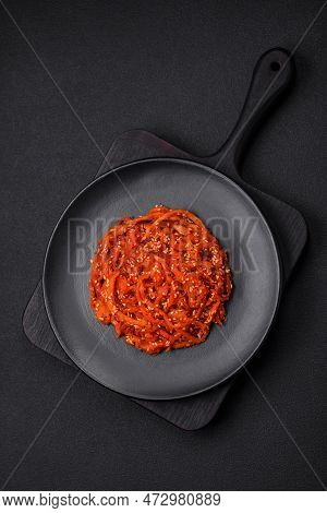 Dried Squid Chopped Into Slices And Seasoned With Sesame Seeds And Spices