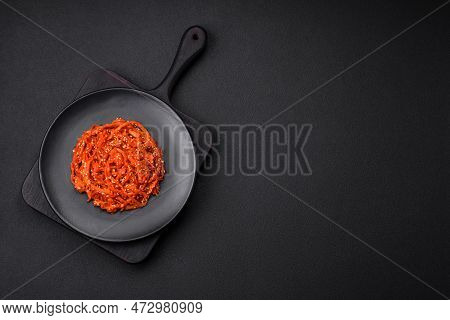 Dried Squid Chopped Into Slices And Seasoned With Sesame Seeds And Spices