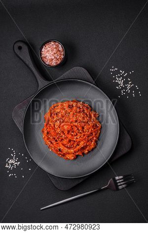 Dried Squid Chopped Into Slices And Seasoned With Sesame Seeds And Spices
