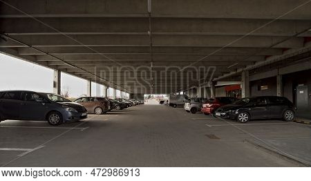 Multi-storey Car Park At The Shopping Mall. The Lower Level Of The Car Park With Parked Passenger Ca