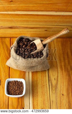 Sack With Coffee Beans And Wooden Spoon - Fresh Coffee Beans In Cloth Sacks