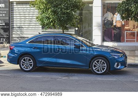 Side, Turkey - February 11 2023:   Blue Hyundai Ioniq   Is Parked  On The Street On A Warm  Day Agai