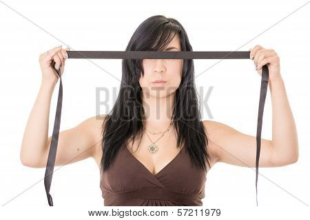 Hispanic young woman blindfolded. Black cloth