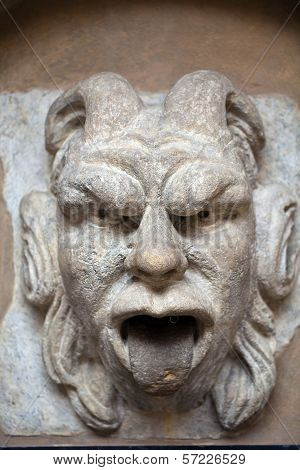 mascaron ornament with sourse of water in collegium maius in cracow