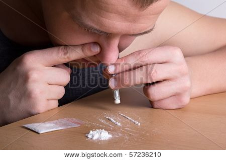 Addict Snorting Drugs
