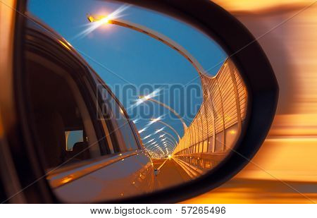 Reflection Of High-speed Road On Car Mirror