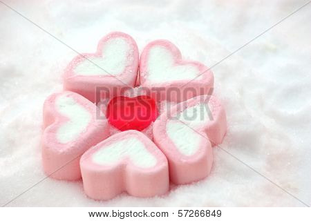 Heart Shape Candy Around By Marshmallows On Snow