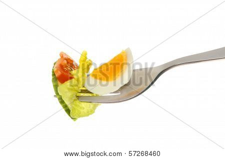 Egg And Salad On Fork