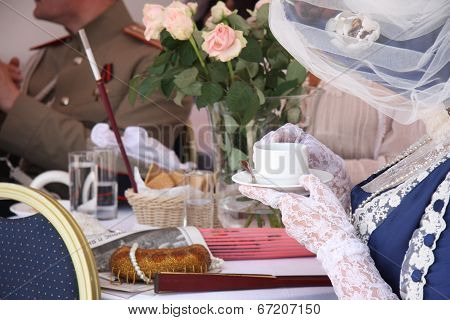 People in vintage restaurant drinking tea