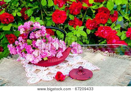 still life bouquet with roses and tea pot