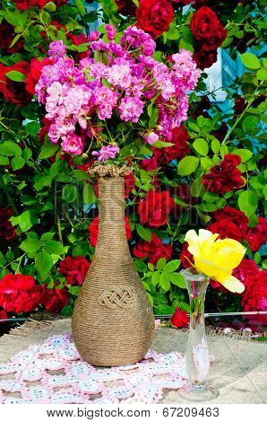 still life bouquet with roses and tea pot