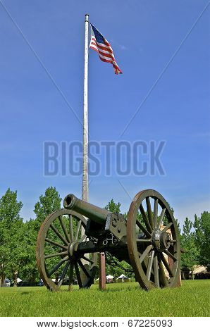 Cannon on display near the American flag