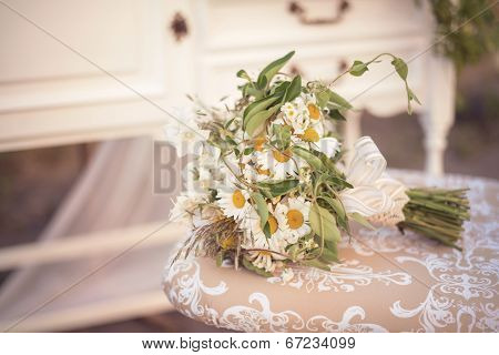 Cute Wild Flowers Engagement Flowers Bouquet On A Vintage Chair In A Shabby Chic Decor