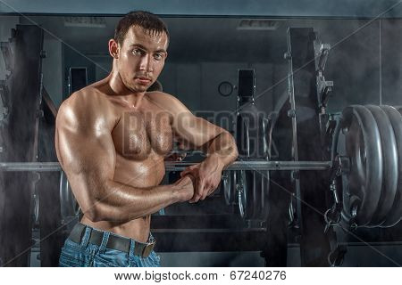Bodybuilder Leaned On The Machine.
