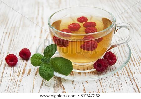 Cup Of Tea With Raspberry