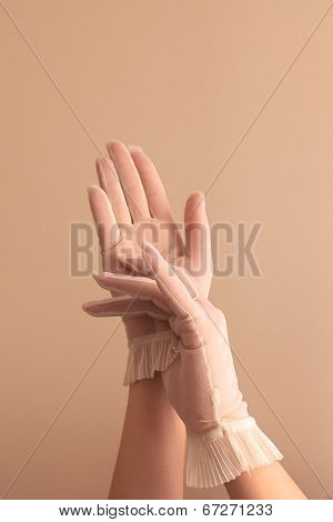 Female Hands Adjusting Vintage Sheer Gloves