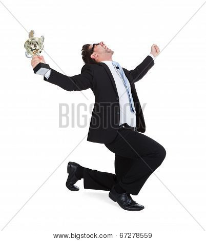 Successful Young Businessman With Trophy
