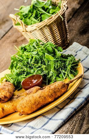 Corn Dog With Fresh Arugula Salad And Hot Dip