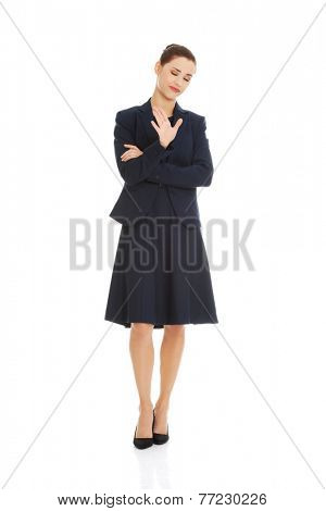 Anoyed and displeased businesswoman standing