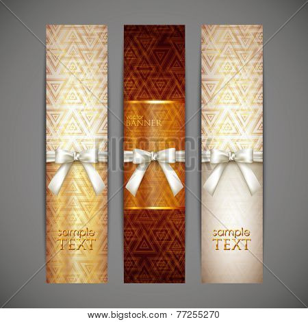 set of golden banners with white bows and ribbons