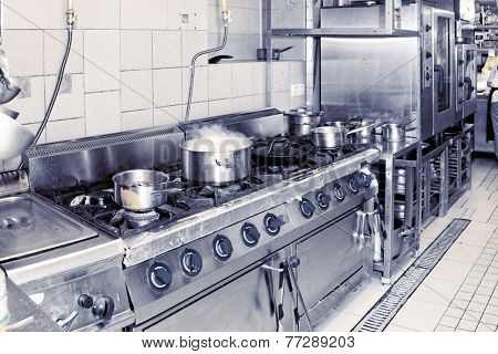 Real restaurant kitchen shot in operation, complex toned image