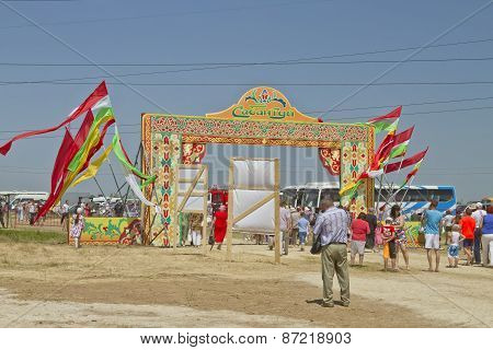 Decorated with the flags of the gate with the words Sabantuy