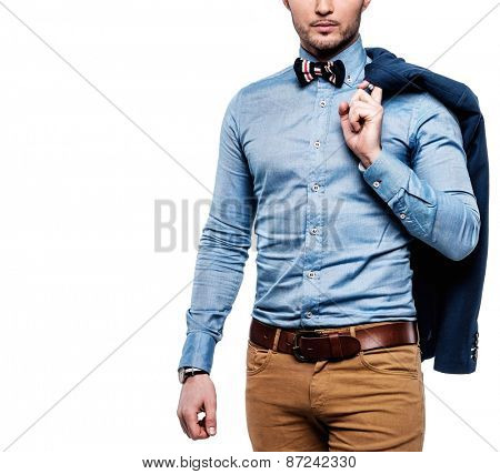 Sharp dressed fashionist with jacket over shoulder 