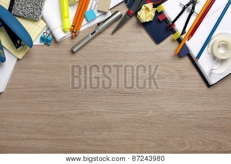 Desk cluttered with office supplies