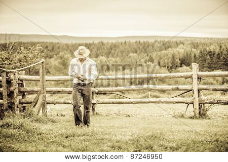 Young Farmer And A Chicken