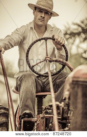 Young Farmer On A Vintage Tractor