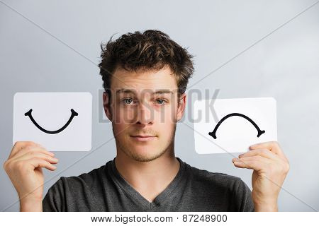 Portrait Of A Person Holding Happy And Unhappy Mood Board