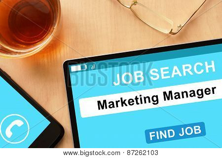 Tablet with Marketing Manager on job search site.
