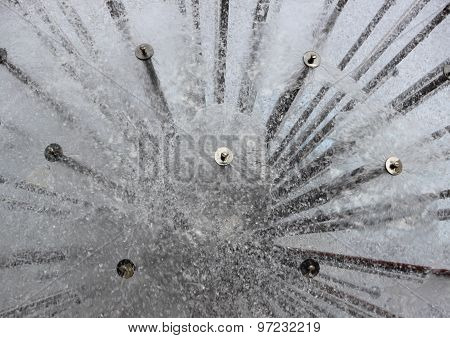 Abstract Water Splash From Circular Steel Tube Fountain