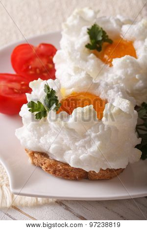 Beautiful Toast With Baked Eggs Orsini On A Plate Close-up. Vertical
