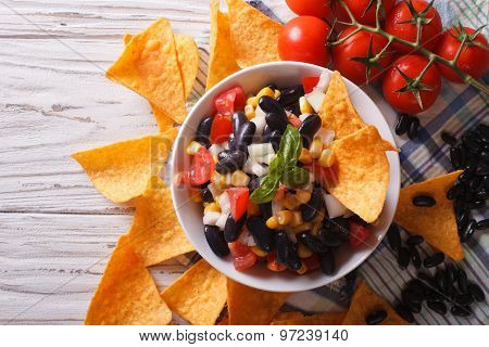 Mexican Salsa  With Beans And Corn Chips Nachos. Horizontal Top View