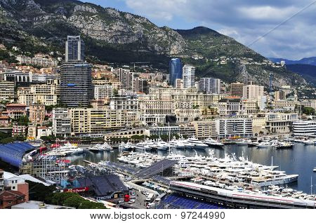 LA CONDAMINE, MONACO - MAY 16: Aerial view of the Port Hercules on May 16, 2015 in La Condamine, Monaco, during the preparations for the 73 Monaco Grand Prix, and Monte Carlo in the background