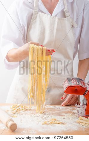 Young Woman Chef Prepares Homemade Pasta